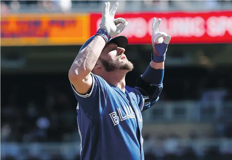  ?? — THE ASSOCIATED PRESS ?? Toronto third baseman Josh Donaldson celebrates one of his two homers on Sunday in Minneapoli­s. Despite his heroics, the Jays lost 13-7.
