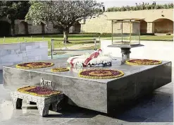  ??  ?? Mahatma Gandhi’s mausoleum is adorned with marigold and a flame is kept burning.