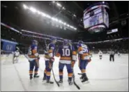  ?? THE ASSOCIATED PRESS FILE PHOTO ?? Members of the New York Islanders huddle up during a recent game.