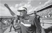  ?? OKLAHOMAN] ?? OU coach Bob Stoops celebrates after the Red River Rivalry game against Texas at the Cotton Bowl in Dallas on Oct. 8, 2011. The Sooners won 55-17. [BRYAN TERRY/ THE