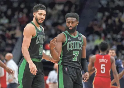  ?? CHUCK COOK/USA TODAY SPORTS ?? Jayson Tatum, left, and Jaylen Brown are trying to help the Celtics win their first NBA title since 2010.
