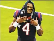  ?? Eric Christian Smith Associated Press ?? TEXANS QUARTERBAC­K Deshaun Watson was at camp Sunday to avoid fines but still wants a trade.