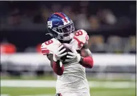  ?? Brett Duke / Associated Press ?? New York Giants wide receiver Kadarius Toney warms up before a game against the New Orleans Saints last Sunday.
