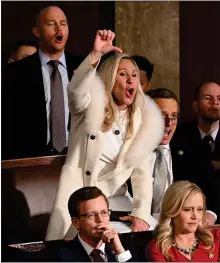  ?? JIM WATSON — AFP/GETTY IMAGES/ TNS ?? Rep. Marjorie Taylor Greene, R-GA., reacts as President Joe Biden delivers the State of the Union address Feb. 7 at the Capitol.