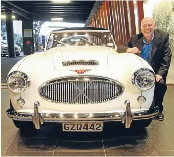  ?? Photo: KENT BLECHYNDEN/FAIRFAX NZ ?? Smooth ride: Mike Baucke, of Tawa company The Surgery, in the Museum Hotel lobby during the unveiling of a 3L Austin Healey restored for a Wellington businessma­n.