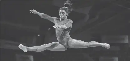  ?? THOMAS KIENZLE/GETTY IMAGES FILE ?? The Gold Over America Tour starring gymnastics legend Simone Biles will visit Rocket Mortgage FieldHouse in Cleveland on Oct. 27.