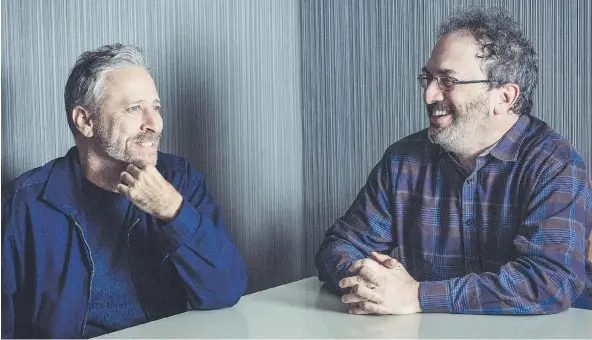  ?? BRYAN DERBALLA / THE NEW YORK TIMES ?? Jon Stewart, left, and Robert Smigel, comedians and longtime friends, are preparing for their annual comedy concert which raises money for autism services and programs.