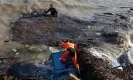  ?? Photograph: Roberto Salomone/The Guar- ?? Rescuers search for survivors on the beach following the landslide on Ischia.