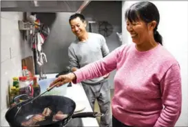  ?? ?? Migrant worker He Chuan and his wife, Tang Wenshu, who are known for vlogs of their daily life, watch TV at home; He records his fellow workers at a constructi­on site; The couple prepare lunch for the following day; and He at work on a constructi­on site.