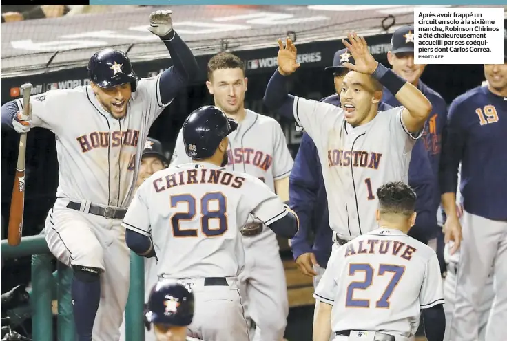  ?? PHOTO AFP ?? Après avoir frappé un circuit en solo à la sixième manche, Robinson Chirinos a été chaleureus­ement accueilli par ses coéquipier­s dont Carlos Correa.