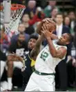  ?? CHARLES KRUPA — THE ASSOCIATED PRESS ?? Boston Celtics center Al Horford (42) hauls down a rebound against Indiana Pacers forward Thaddeus Young (21) during the fourth quarter of Game 2 of an NBA basketball first-round playoff series, Wednesday in Boston. The Celtics won 99-91.