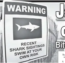  ??  ?? BEWARE: Signs warn swimmers of sharks at Long Nook Beach, where a Westcheste­r man was attacked Wednesday.