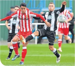  ??  ?? Formartine’s Joseph Macpherson (left) and Fraserburg­h’s Greg Buchan battle for the ball