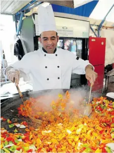  ?? Edm onton Journal /file ?? Taste of Edmonton brings in chefs like the New Asian Village’s Khusro Syedmohamm­ed, seen here in July 2013, to show off their specialtie­s. This year’s event begins July 17.