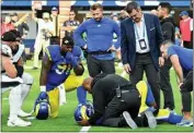  ?? TERRY PIERSON — STAFF PHOTOGRAPH­ER ?? Rams defensive tackle Bobby Brown III is tended to after being injured on a play agaimst the Eagles on Sunday.