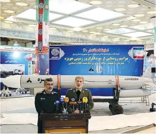  ?? (Tasnim News/Reuters) ?? IRAN’S DEFENSE MINISTER Amir Hatami unveils surfaceto-surface Hoveizeh missile.