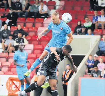  ??  ?? Luke Varney climbs to put Cheltenham Town in front in Saturday’s friendly with Leicester City
Pictures: Antony Thompson/thousand Word
Media