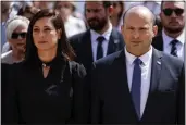  ?? AMIR COHEN — POOL PHOTO ?? Israeli Prime Minister Naftali Bennett and his wife,
Gilat, take part in the ceremony marking Holocaust Remembranc­e Day at Warsaw Ghetto Square at the Yad Vashem memorial in Jerusalem on Thursday.