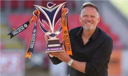  ?? Photograph: Ian MacNicol/Getty Images ?? Scott Booth with the SWPL trophy earlier this month after another title success with Glasgow City.