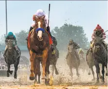  ?? Skip Dickstein / Albany Times Union ?? Justify ( second from left) outdueled Good Magic ( right) at the Kentucky Derby on May 5. It could happen again at Pimlico.