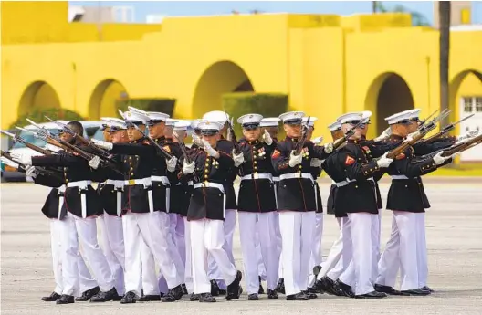 ?? NELVIN C. CEPEDA U-T PHOTOS ?? Members of the Silent Drill Platoon of the Marine Corps Battle Color Detachment move with precision at a ceremony marking the MCRD’S 100-year anniversar­y.