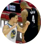  ??  ?? Warriors guard Klay Thompson pumps his fists in delight as Rockets forward PJ Tucker walks dejectedly to the bench late in game seven.