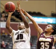  ?? Arkansas Democrat-Gazette/THOMAS METTHE ?? UALR’s Ronjanae DeGray (00) lays in a shot while being defended by Louisiana-Monroe’s Jamie Means during Thursday night’s game at the Jack Stephens Center in Little Rock.