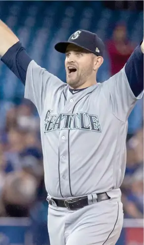  ?? Press, AP) (Photo by Fred Thornhill, The Canadian ?? Seattle Mariners starting pitcher James Paxton celebrates after throwing a no-hitter against the Toronto Blue Jays on Tuesday.