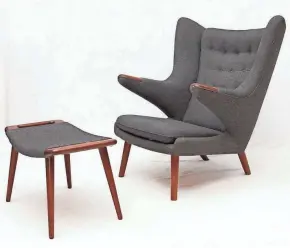  ?? 1ST DIBS ?? Designed by Hans Wegner, this modern Papa Bear chair envelopes the person sitting in it.