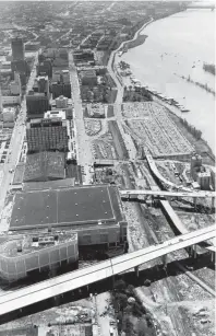  ?? THE COMMERCIAL APPEAL ?? Downtown Memphis as seen in this March 28, 1973, aerial photograph taken looking toward the south before the Mid-america Mall, Morgan Keegan Tower and Mud Island River Park were built.
