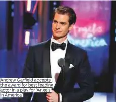  ??  ?? Andrew Garfield accepts the award for best leading actor in a play for ‘Angels in America’.