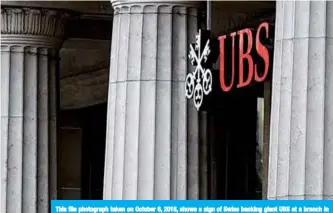  ??  ?? This file photograph taken on October 6, 2018, shows a sign of Swiss banking giant UBS at a branch in Lausanne.