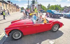  ?? ?? Around 50 cars joined the colourful fundraisin­g convoy.