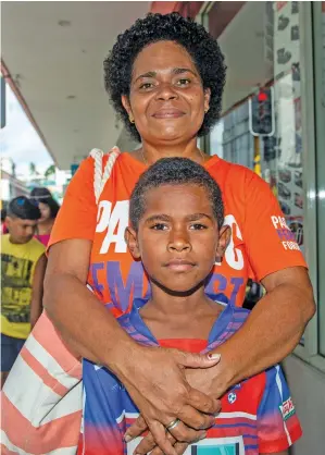  ?? Photo: Leon Lord ?? Marica Komai with her son Iliesa Komai, 11, after receiving their educationa­l assistance in Suva on January 26, 2023.