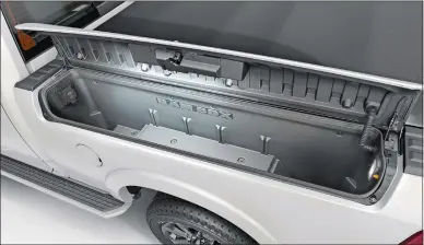  ?? FCA US LLC VIA AP ?? Left, the 2020 Ram 2500 is equipped with the RamBox lockable compartmen­ts. The model that debuted in 2018 comes standard with a center console that’s both spacious and configurab­le.