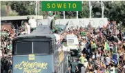  ?? ITUMELENG ENGLISH African News Agency (ANA) ?? SUPPORTERS cheer as the champions parade at Orlando Stadium in Soweto. |