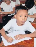  ?? AFP ?? Nine-year-old Daniel Cabrera attends class at a school in Mandaue City.