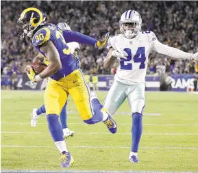  ?? MARCIO JOSE SANCHEZ/AP ?? Rams running back Todd Gurley scores past the Cowboys’ Chidobe Awuzie during the first half of Saturday’s game in Los Angeles. The Rams won 30-22.