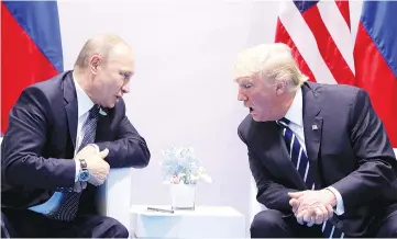  ?? — Reuters photo ?? Trump speaks with Putin during their bilateral meeting at the G20 summit in Hamburg, Germany.