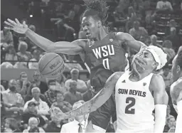  ?? ROB SCHUMACHER/THE REPUBLIC ?? Washington State forward Efe Abogidi (0) battles for the rebound against Arizona State forward Jalen Graham (2) at Desert Financial Arena on Wednesday.