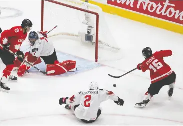  ?? Greg Southam / Postmedia News ?? Ryan Suzuki pops in one of Canada’s 10 goals in Tuesday night’s win in Edmonton.