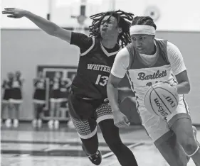  ?? CHRIS DAY/THE COMMERCIAL APPEAL ?? Bartlett’s Raven Sims drives to the basket during the Region 8-4A championsh­ip against Whitehaven on March 1.