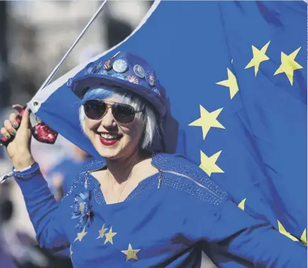  ??  ?? 0 THE WONDER OF EU: Madeleina Kay entertains the public while singing about Brexit outside Parliament yesterday