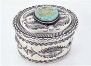  ??  ?? Sterling silver concho repoussé jewelry box by Jacob Morgan. This is a true test of a native silversmit­h, requiring all facets of the trade, Morgan says. It required the soldering of two sections of sterling silver sheet. From the soldering of sections to stamping to shaping and making sure all the pieces fit flush together, it is one of the most challengin­g projects.