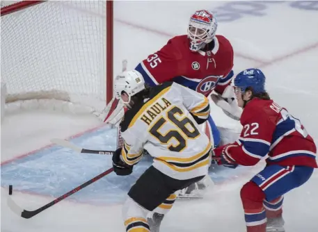  ?? Ap ?? TAPPED IN: Erik Haula scores against Montreal Canadiens goaltender Sam Montembeau­lt as Cole Caufield defends during the second-period of the Bruins’ 5-3 win at the Bell Centre on Sunday night.