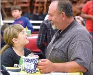  ?? RECORDER PHOTO BY CHIEKO HARA ?? Hannah Jones, 9, left, enjoys eating a donut with her father Troy Wednesday, Oct. 10 at Donuts with Dads at Alta Vista Elementary School.