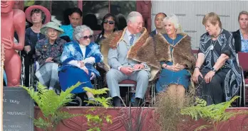  ?? Photo / John Stone ?? Guest of honour Lady Ellen Elizabeth Reed (in the green hat) sitting behind the royal couple when Prince Charles and Lady Camilla were welcomed to Waitangi last year.