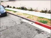  ?? San Diego Union-Tribune ?? AN ILLEGALLY painted red curb in La Jolla Shores. City crews recently painted over 150 feet of curb.