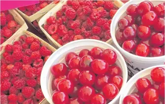  ?? CONTRIBUTE­D ?? Perennial crops like these raspberrie­s and cherries, often come in great quantities over a short period. You have to be ready for the harvest.