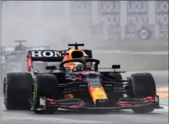  ?? AFP ?? Red Bull’s Dutch driver Max Verstappen (R) drives ahead of Mercedes’ British driver Lewis Hamilton (L) during the Emilia Romagna Formula One Grand Prix on April 18, 2021.